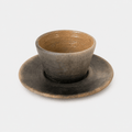 Ceramic cup and saucer set on a white background