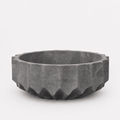 Hexagonal stone bowl on a white background