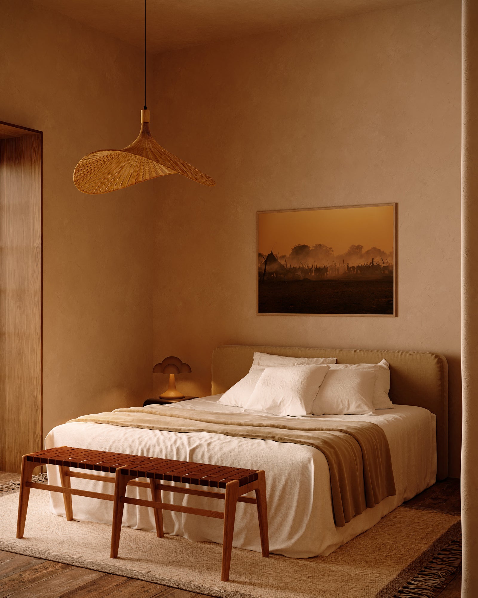 A bed sits in a room. There's an Obakki painting above the headboard.