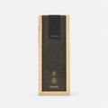 A tall rectangular incense box with a light natural wood frame and a dark charcoal lid featuring concentric circle lines and gold text reading 'hitotoki' and 'Magnolia'.