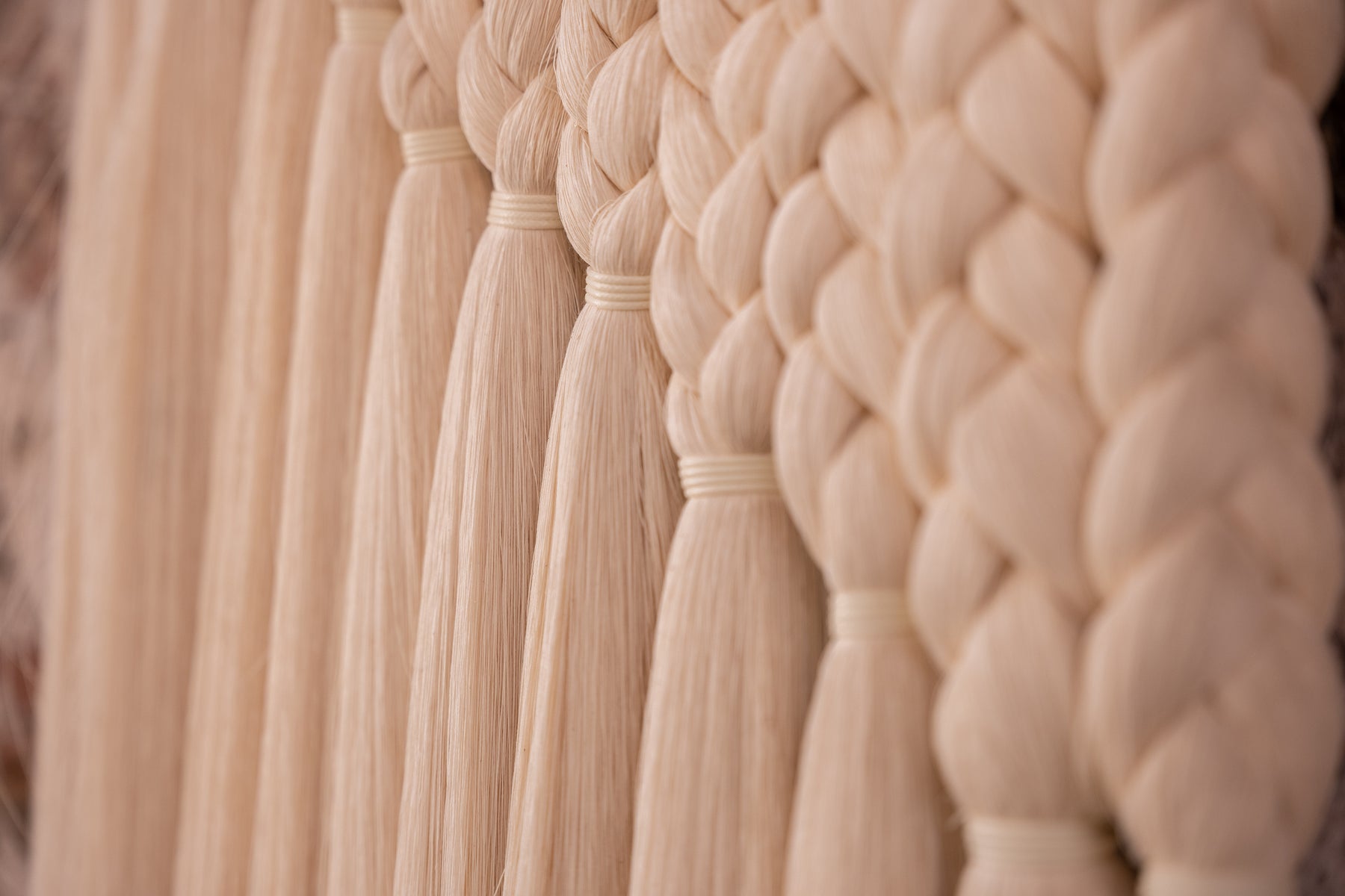 A close up of a braided wall hanging from Caralarga.