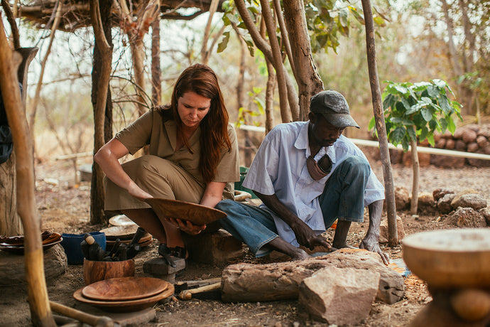 Treana sitting with Amadou while he crafts.
