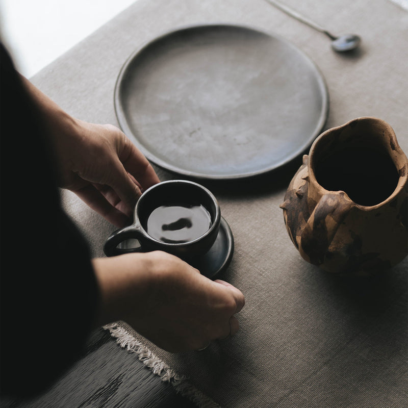 Handmade ceramic mug and saucer